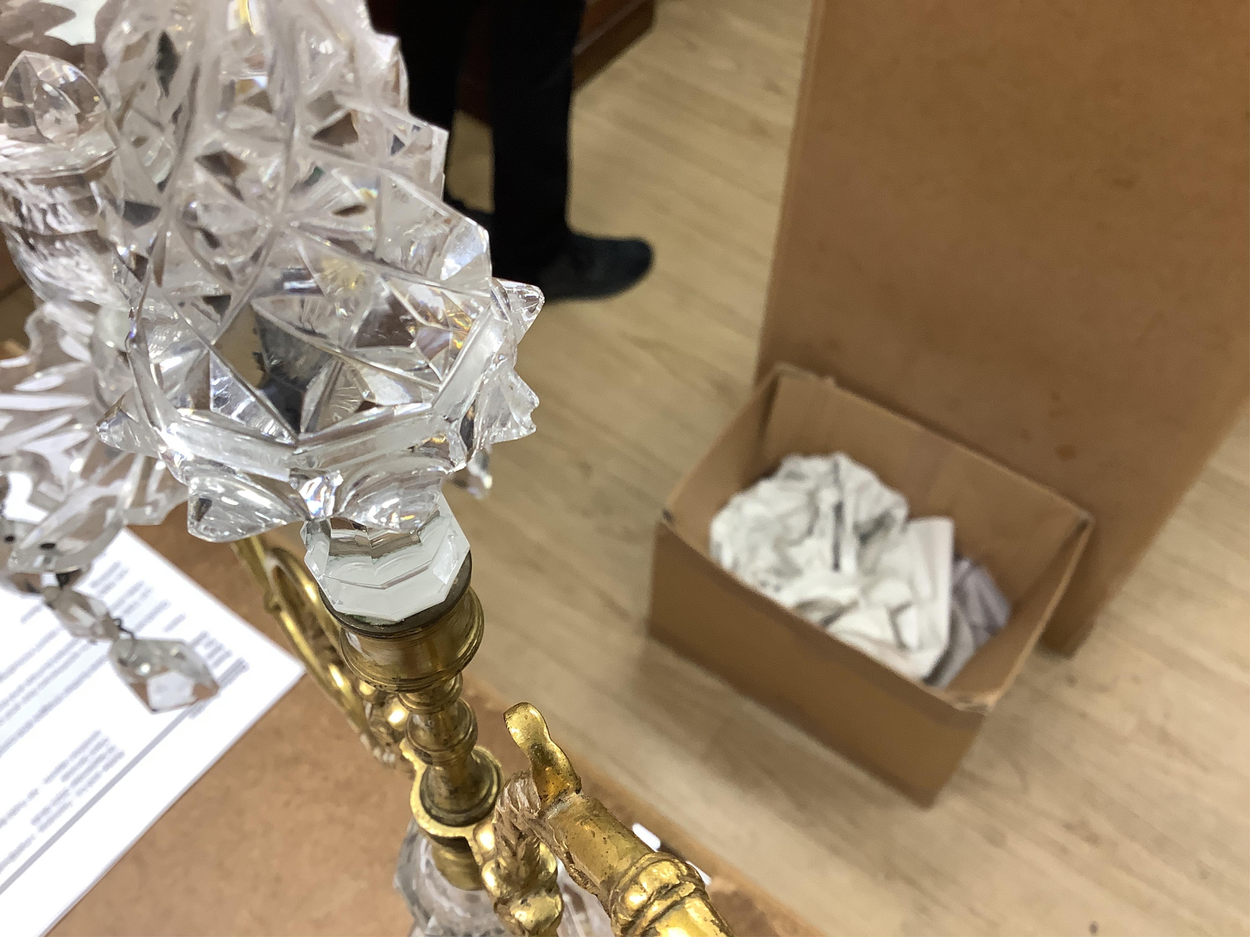 A pair of 19th century glass and gilt metal two branch candelabra with drops, 40cm high